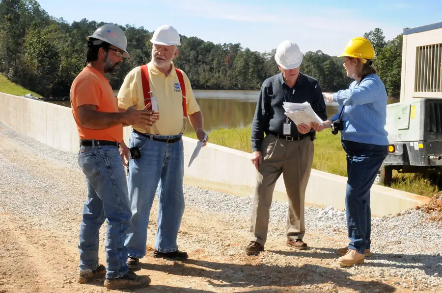Engineers reviewing documents on site