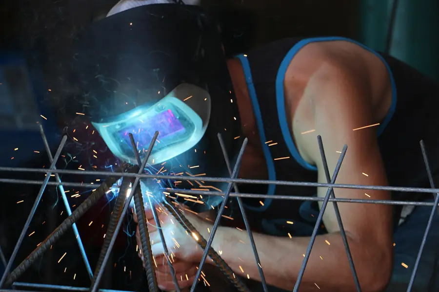 Welder at work with sparks